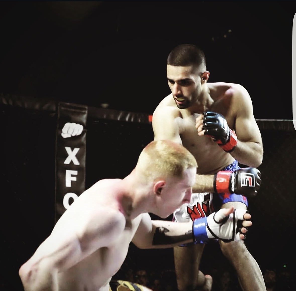 Feroz Khan pressuring an opponent against the fence at XFO