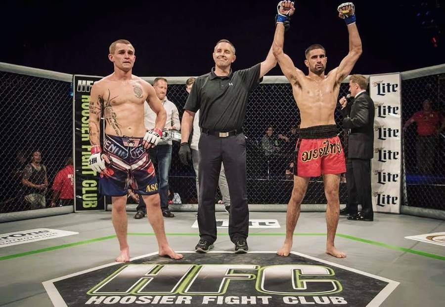 Referee raising Feroz Khan's hand in victory at Hoosier Fight Club